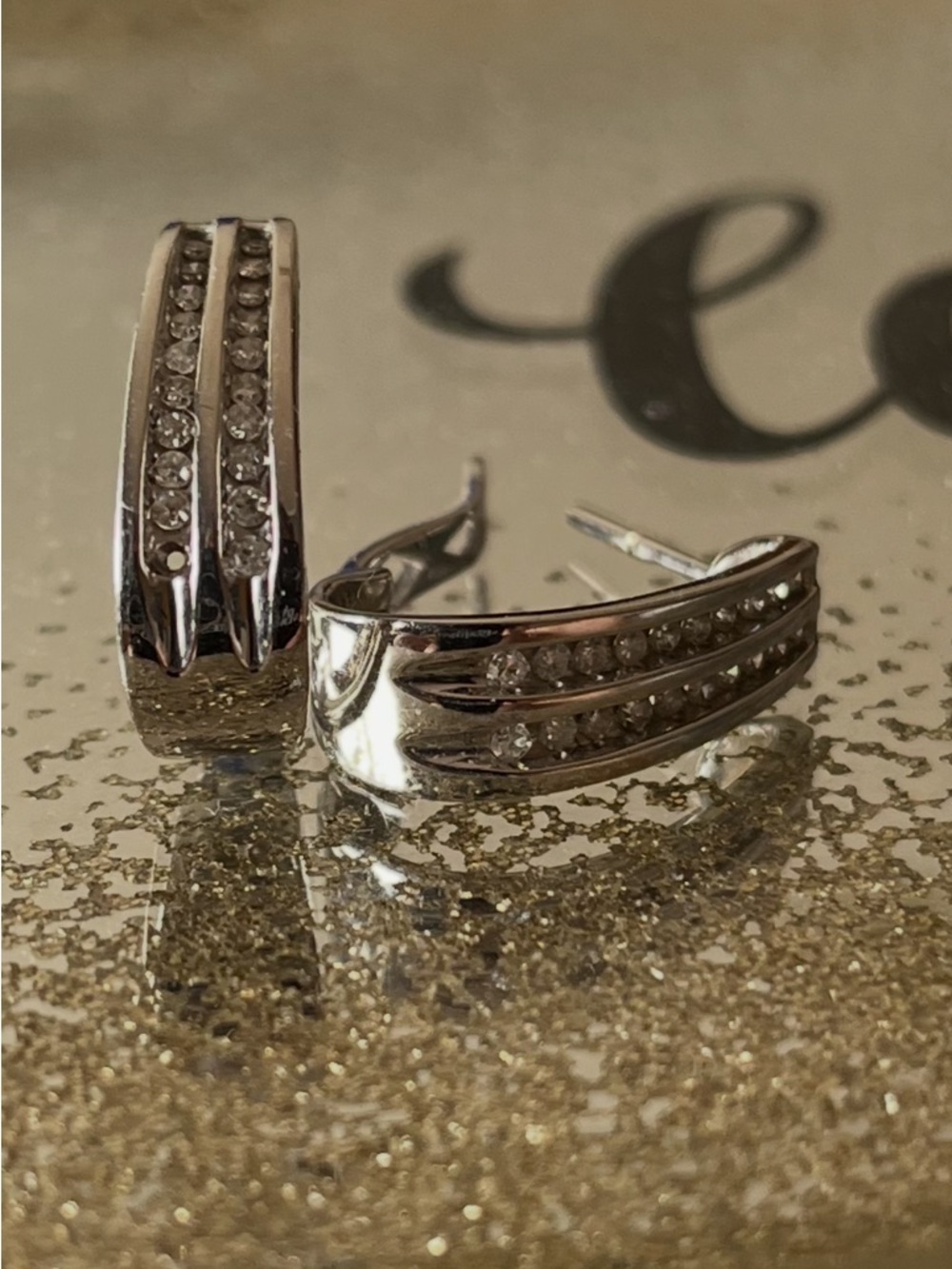 14K WHITE GOLD DIAMOND OVAL EARRINGS. Two rows of 10 diamonds in each earring.